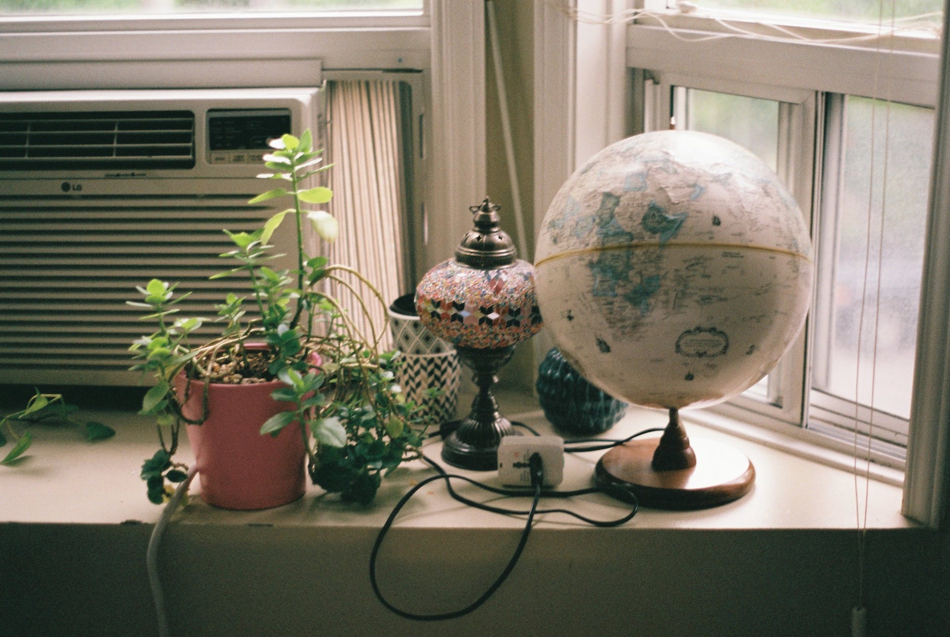 windowsill with globe and plant